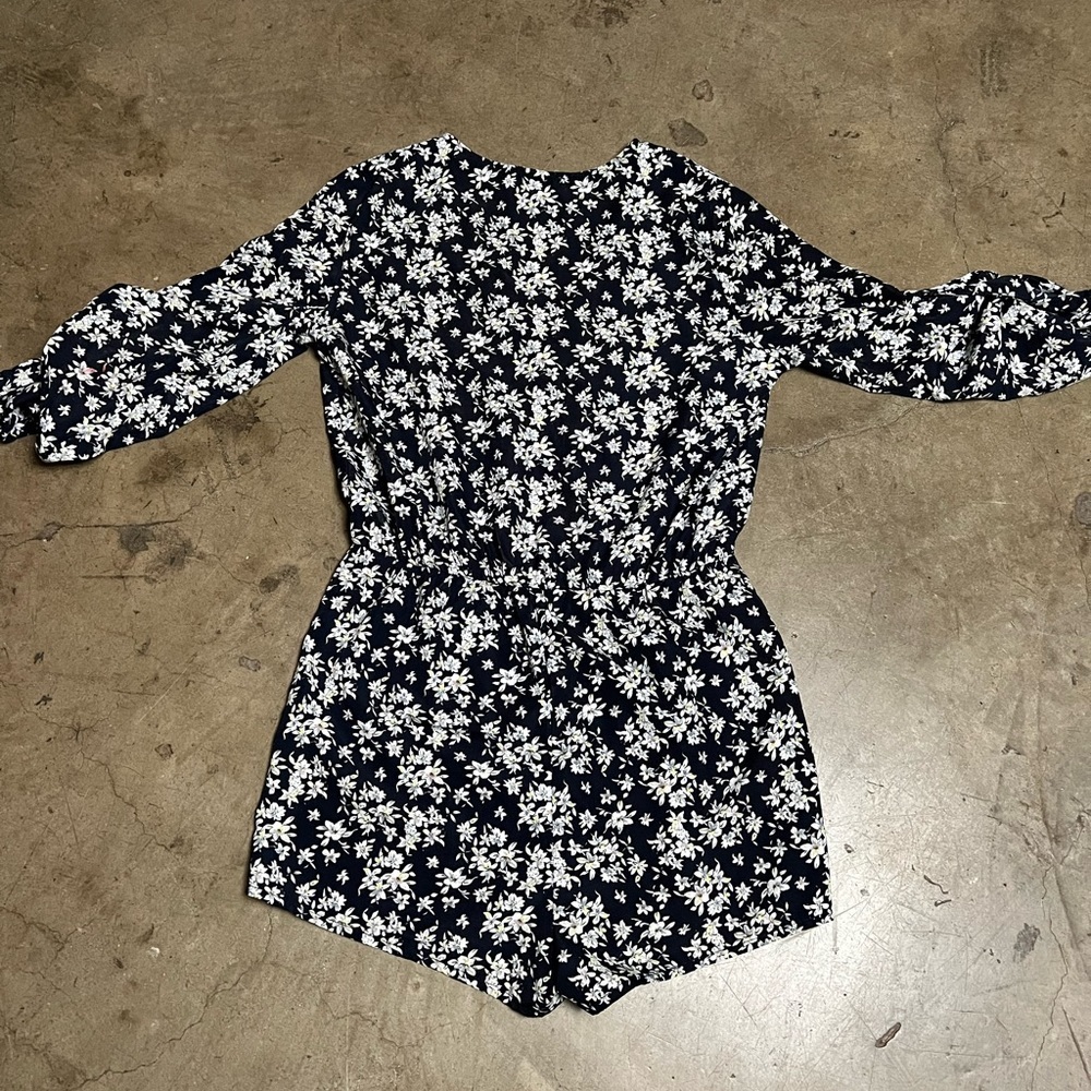 Flower print romper with deep v neckline